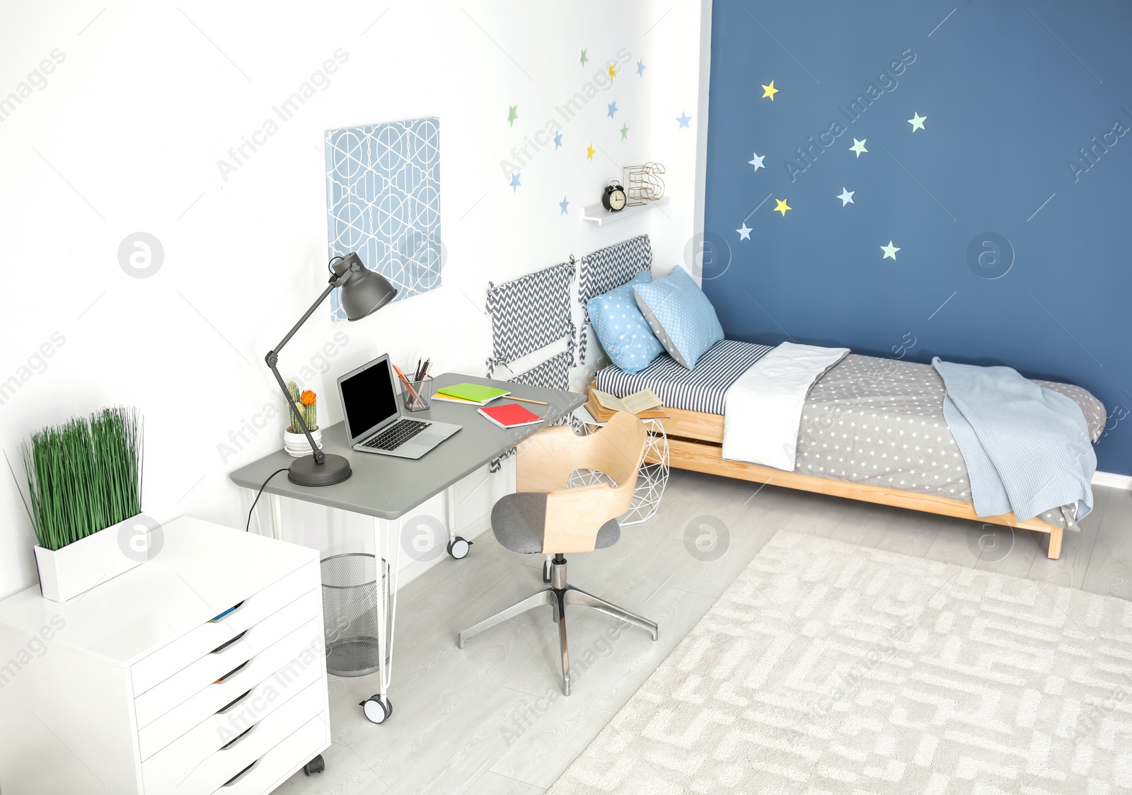 Photo of Modern child room interior with comfortable bed and desk