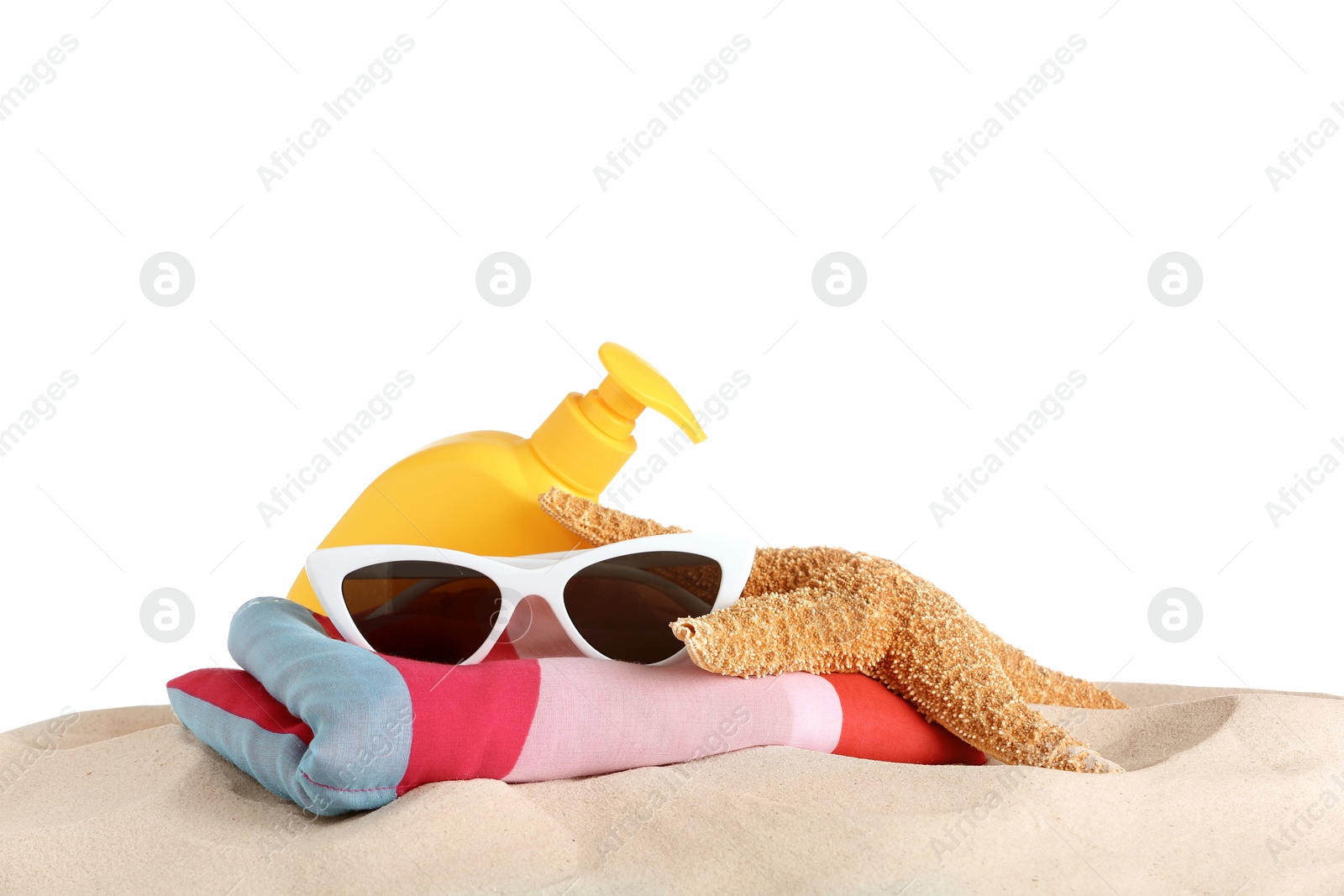 Photo of Beach accessories on sand against white background. Space for text