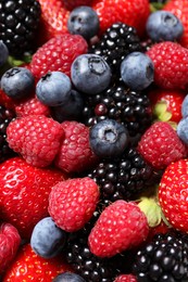 Photo of Many different fresh ripe berries as background, closeup