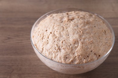 Fresh sourdough in bowl on wooden table, closeup