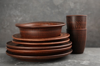 Set of clay utensils on grey table