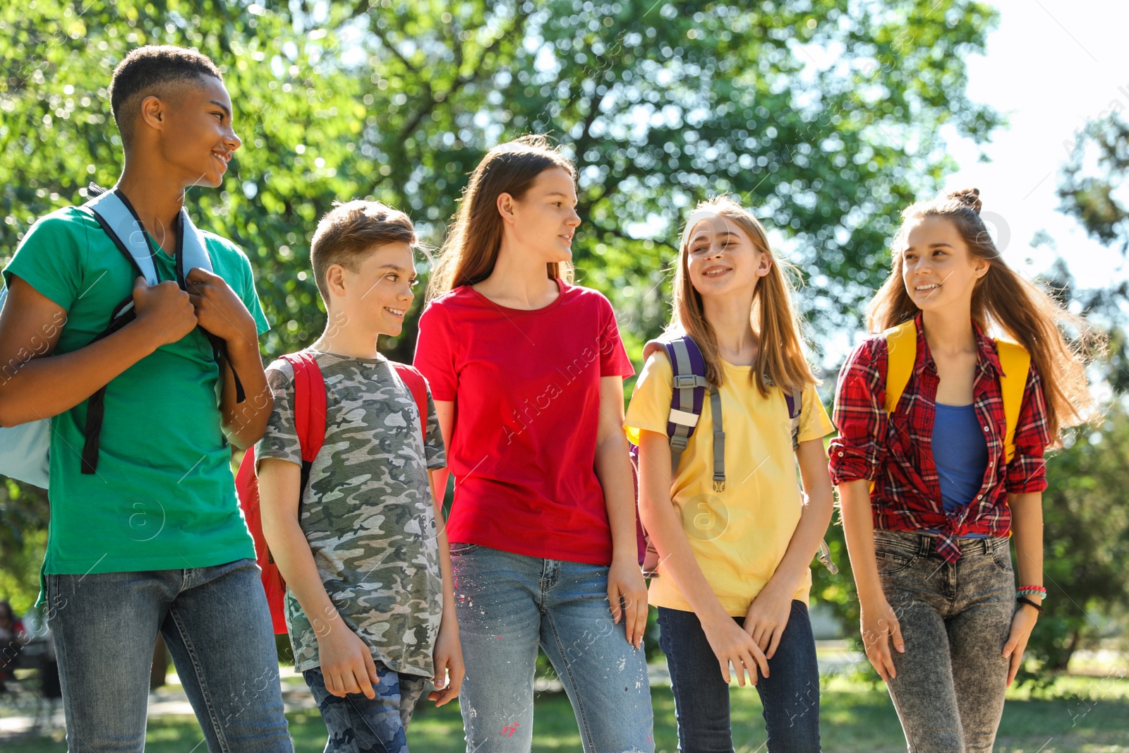 Photo of Group of children outdoors on sunny day. Summer camp