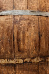 Photo of Traditional wooden barrel as background, closeup. Wine making