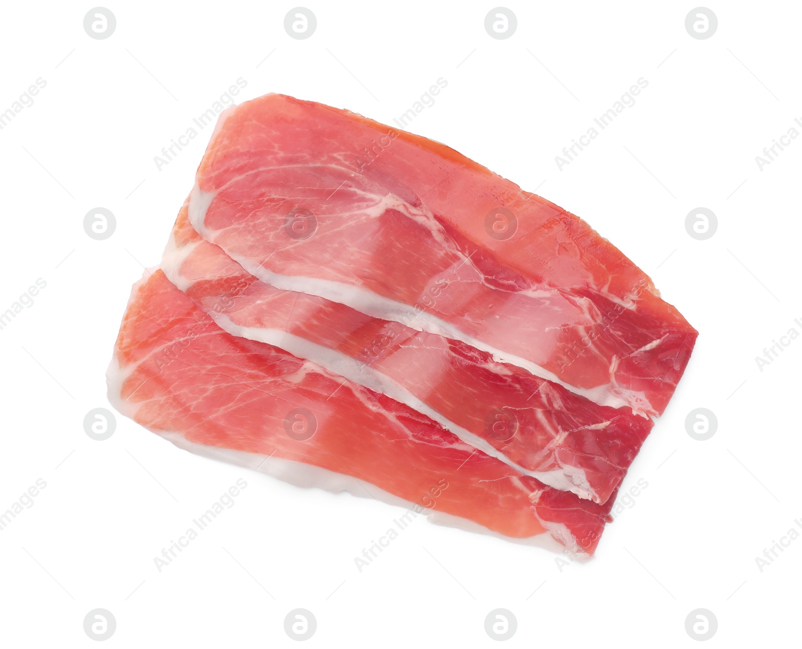 Photo of Slices of delicious jamon isolated on white, top view