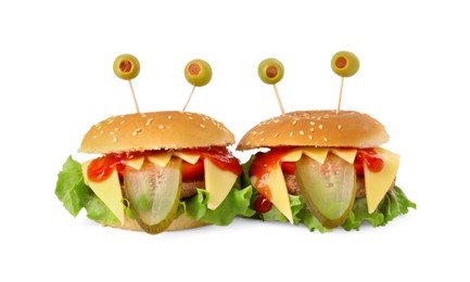 Photo of Cute monster burgers isolated on white. Halloween party food