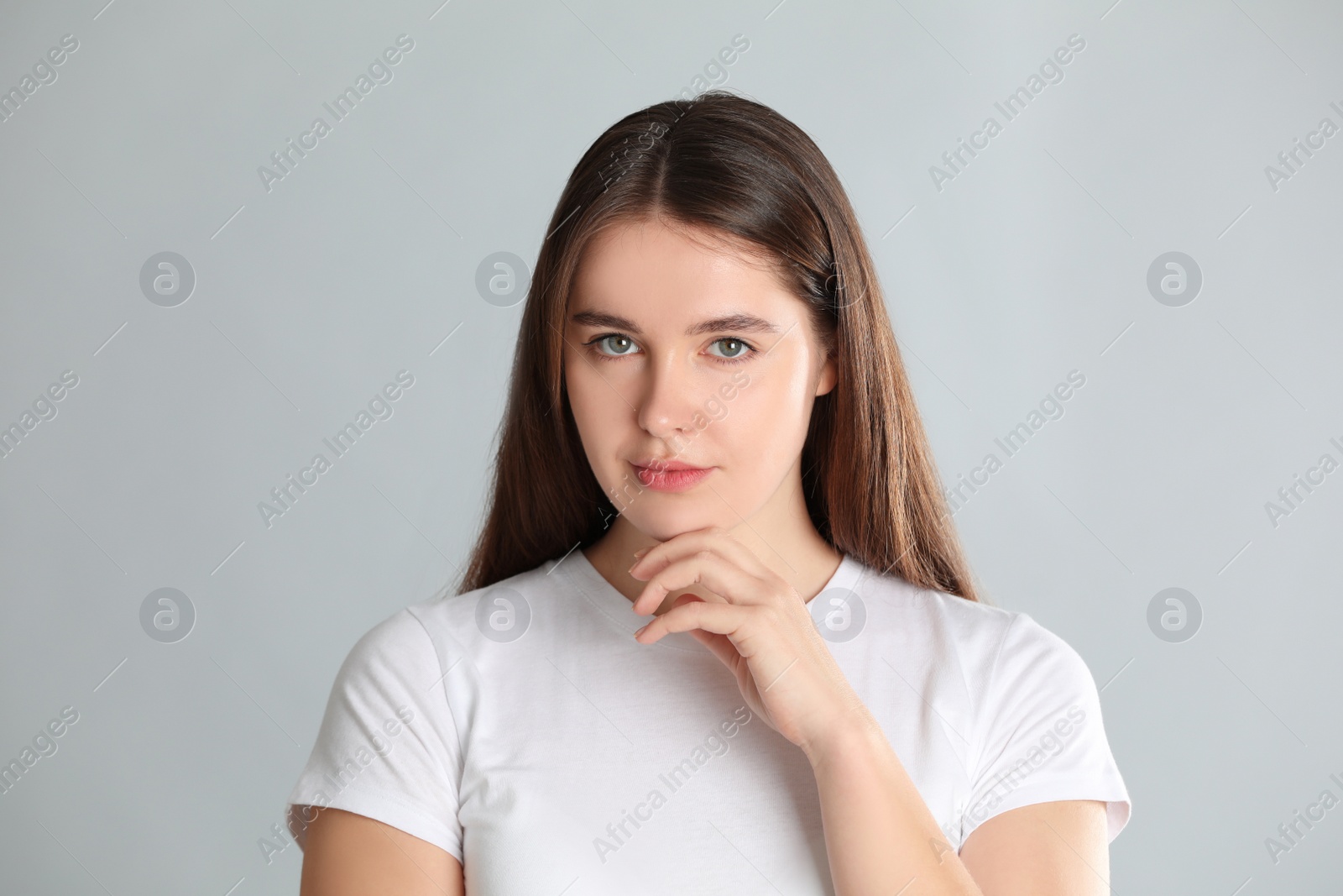 Photo of Portrait of young woman on light background