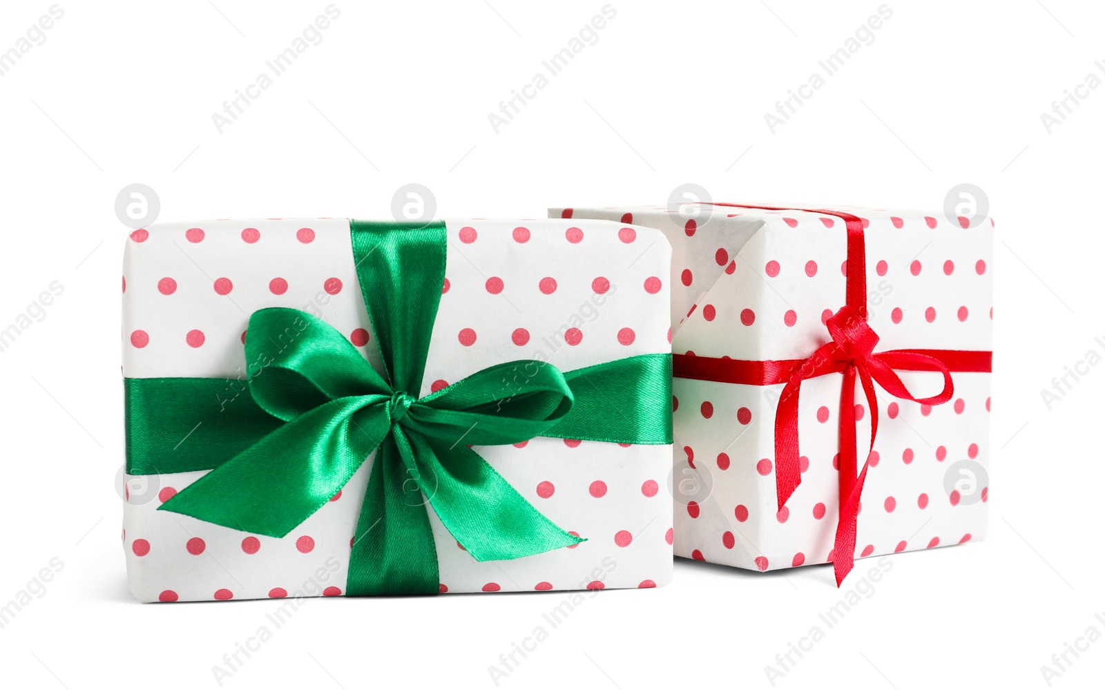 Photo of Beautifully wrapped gift boxes on white background