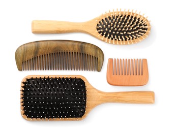 Photo of Set of hair brushes and combs isolated on white, top view