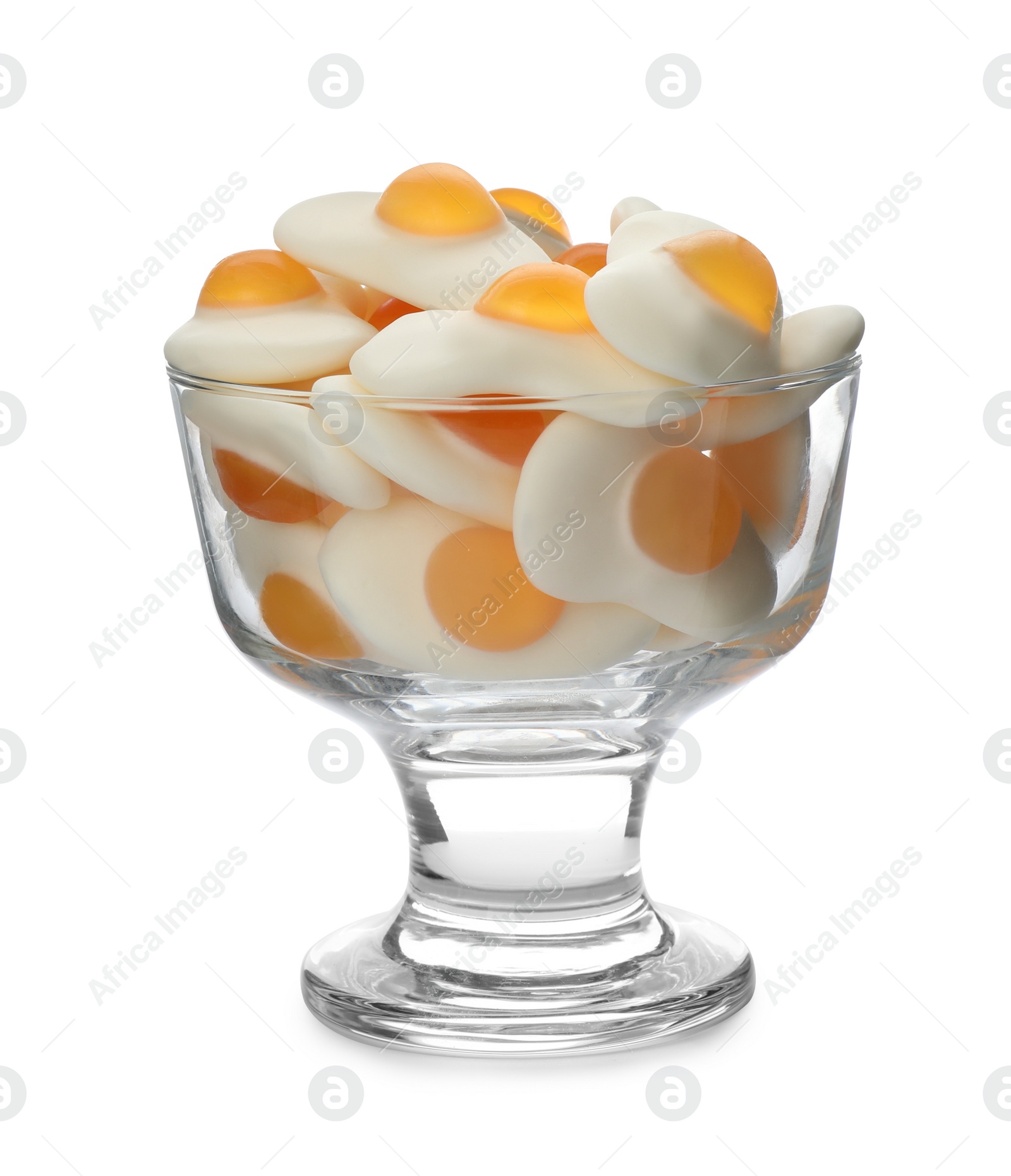 Photo of Glass with tasty jelly candies in shape of egg on white background