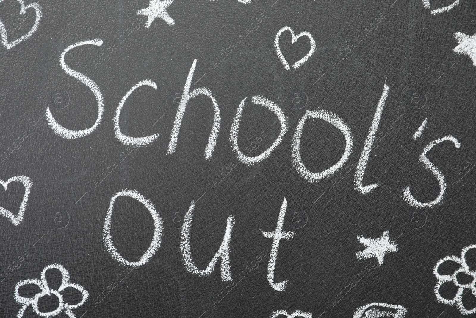 Photo of Words School's Out and pictures on blackboard. Summer holidays