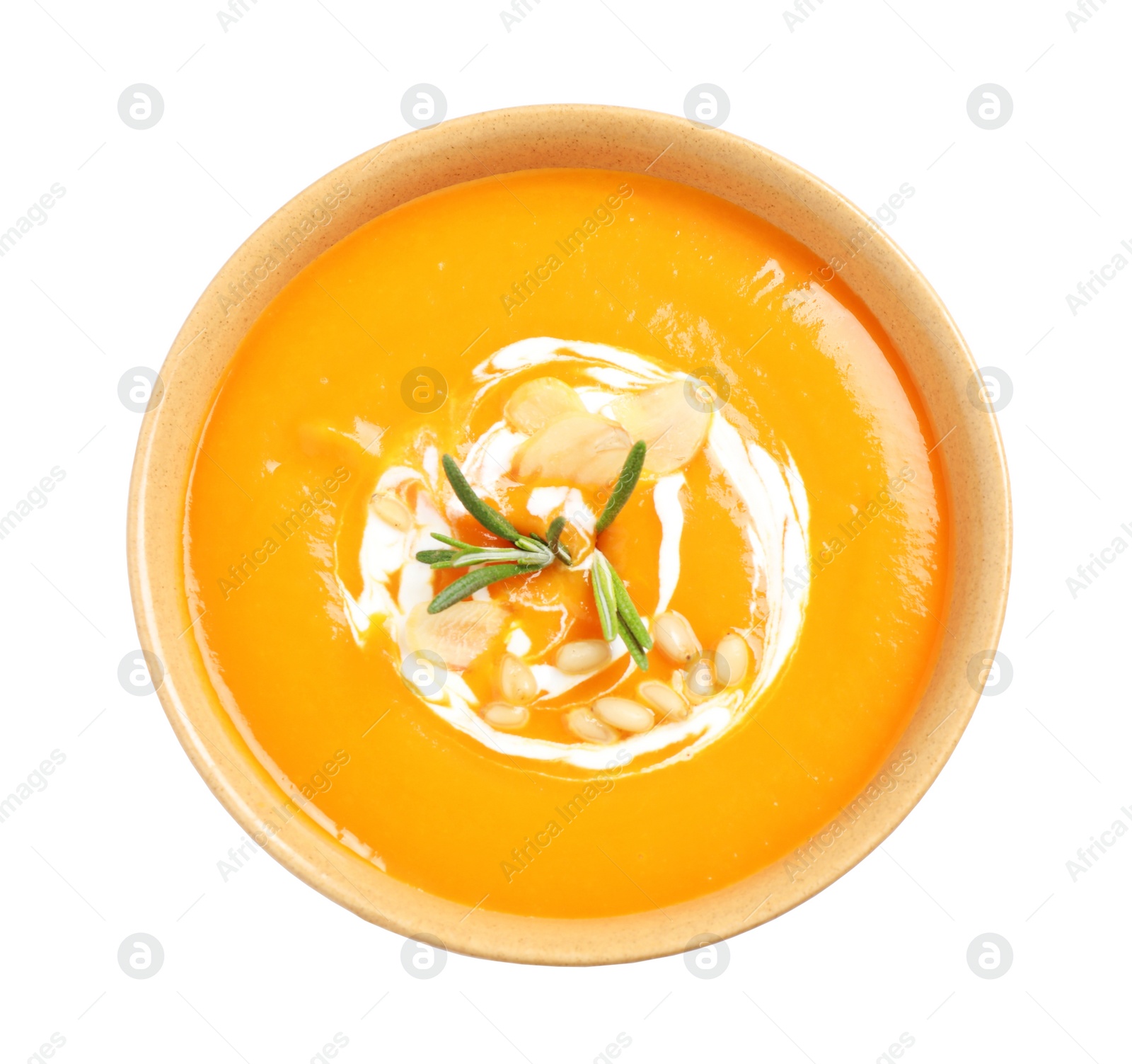 Image of Tasty creamy pumpkin soup in bowl on white background, top view