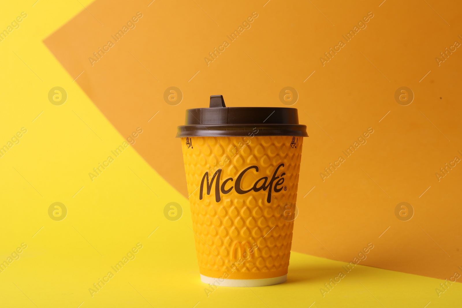 Photo of MYKOLAIV, UKRAINE - AUGUST 12, 2021: Hot McDonald's drink on color background