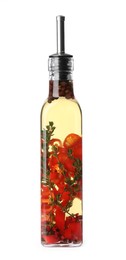 Photo of Glass bottle of cooking oil with spices and herbs isolated on white