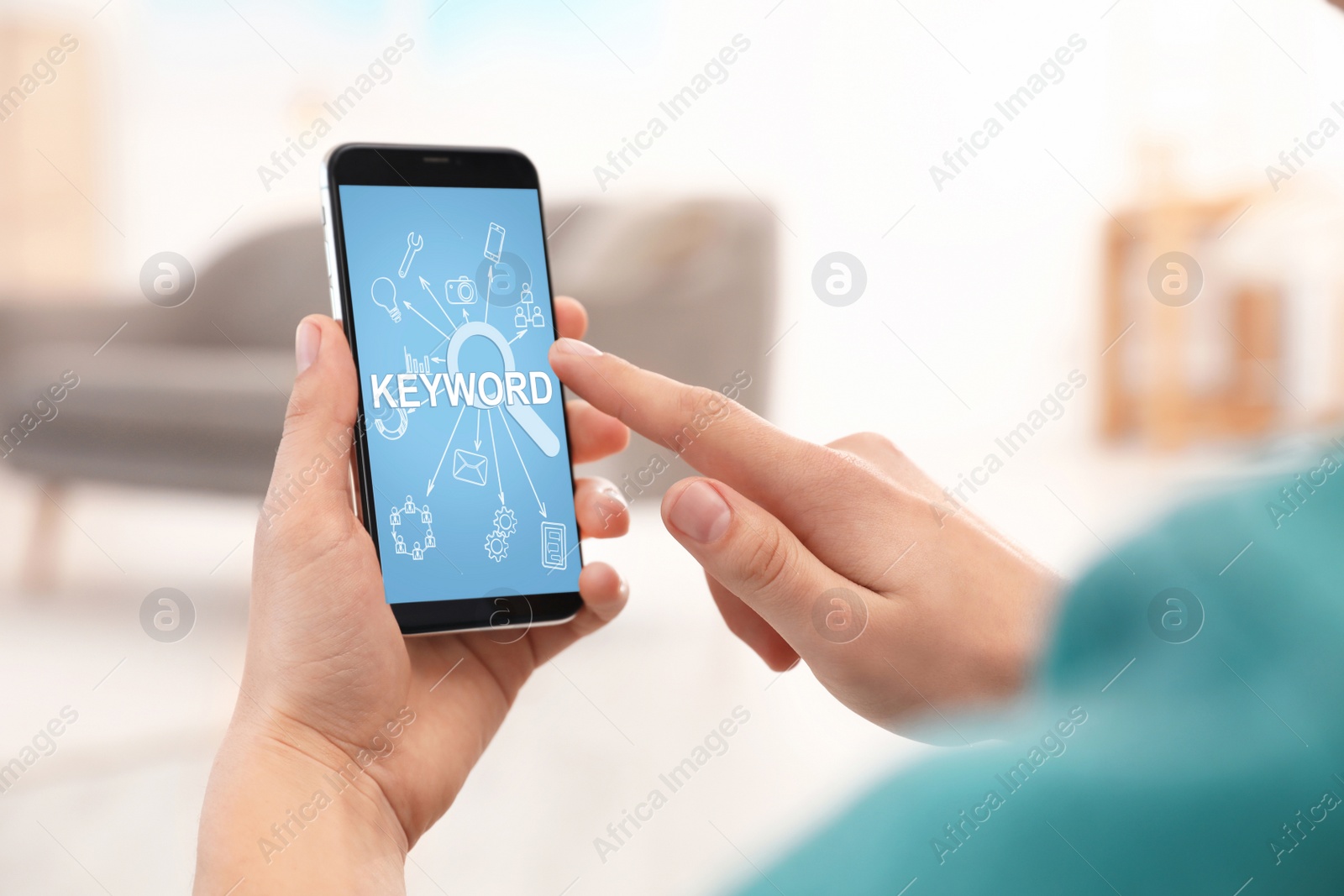 Image of Keywords research concept. Man using smartphone indoors, closeup