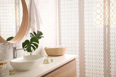 Photo of Modern bathroom interior with stylish white folding screen