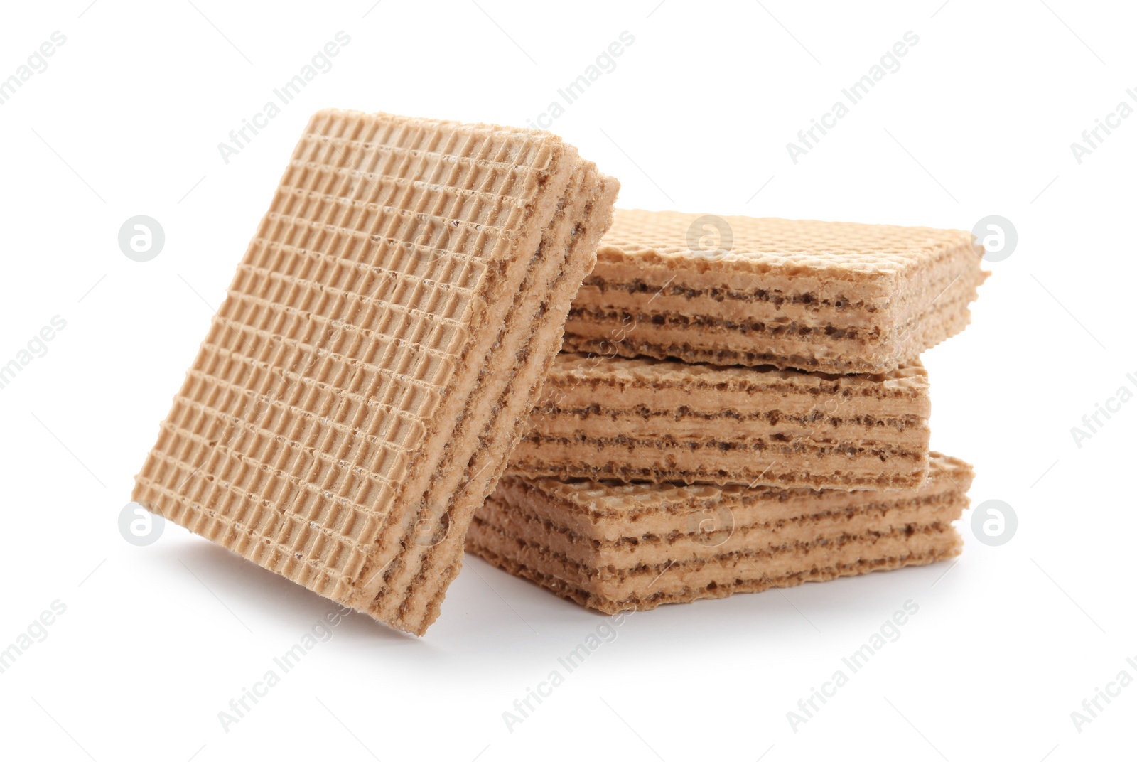 Photo of Delicious crispy wafers on white background. Sweet food