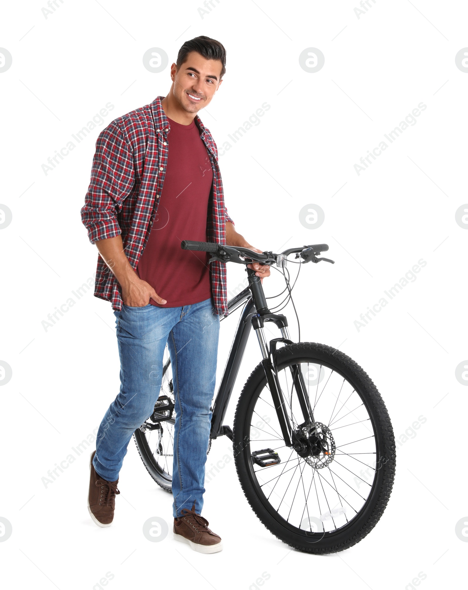 Photo of Handsome young man with modern bicycle on white background