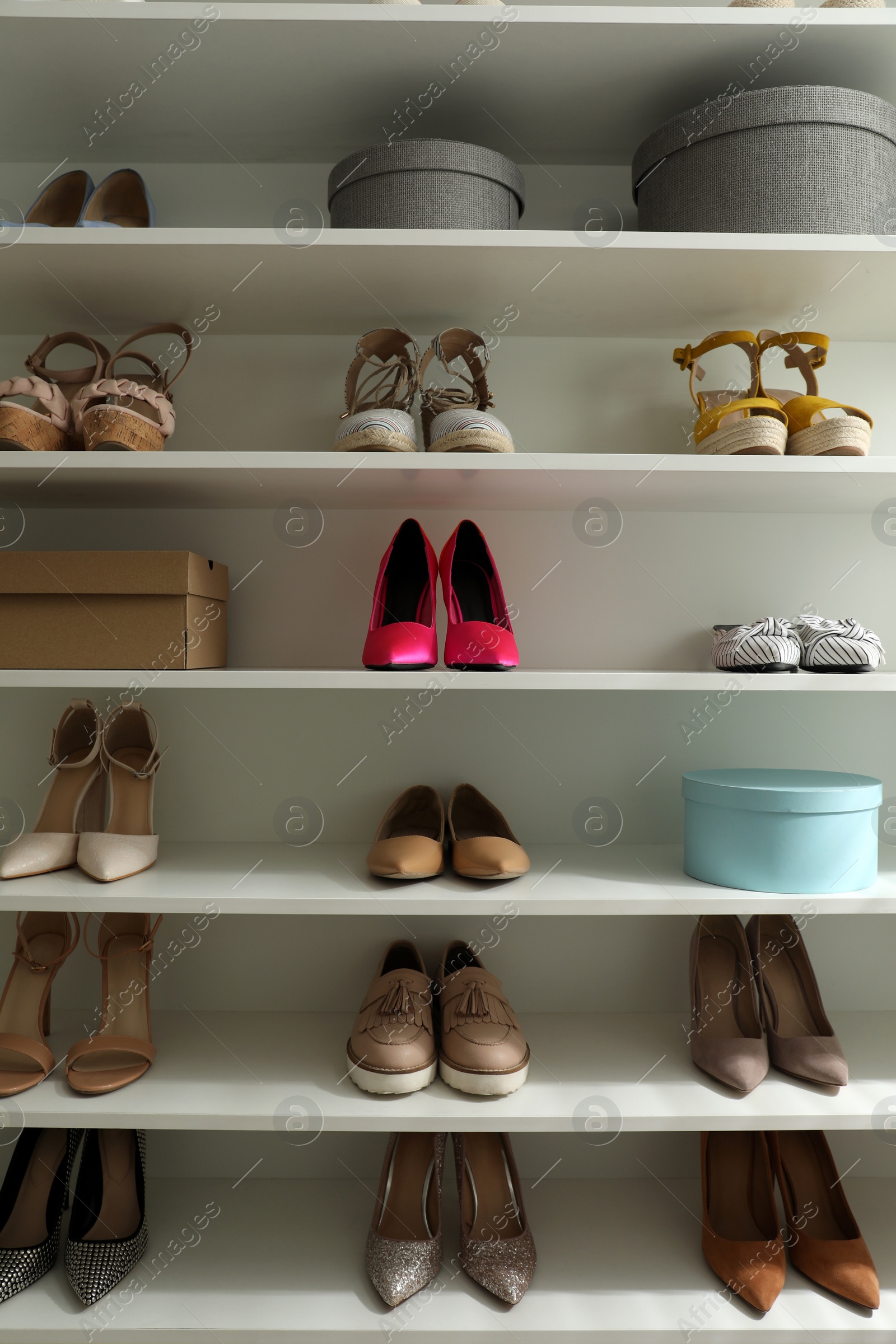 Photo of Storage rack with different stylish women's shoes