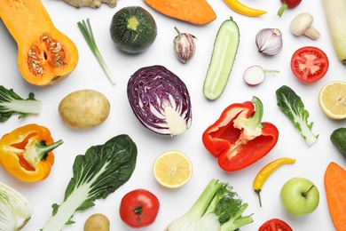 Photo of Flat lay composition with fresh ripe vegetables and fruits on white background