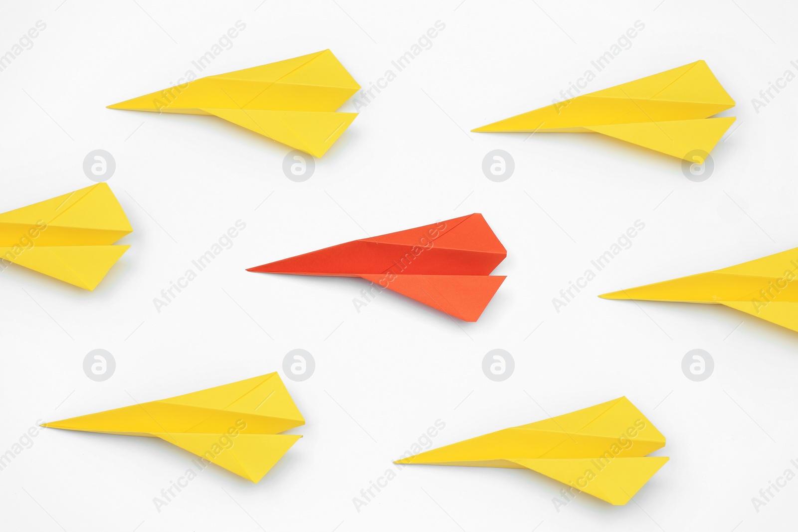 Photo of Handmade colorful paper planes on white table, flat lay. Uniqueness concept