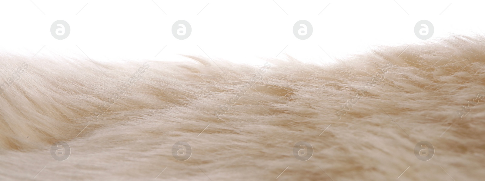 Photo of Soft beige faux fur isolated on white