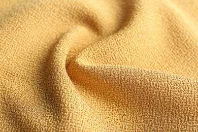 Texture of beautiful yellow fabric as background, closeup