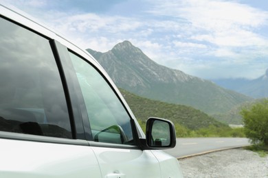 Photo of Beautiful view of car on roadside in mountains. Road trip