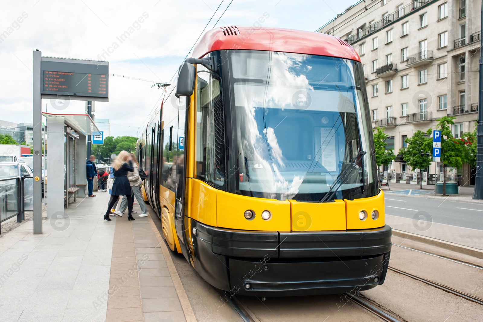 Photo of Beautiful tram on railroad near building outdoors