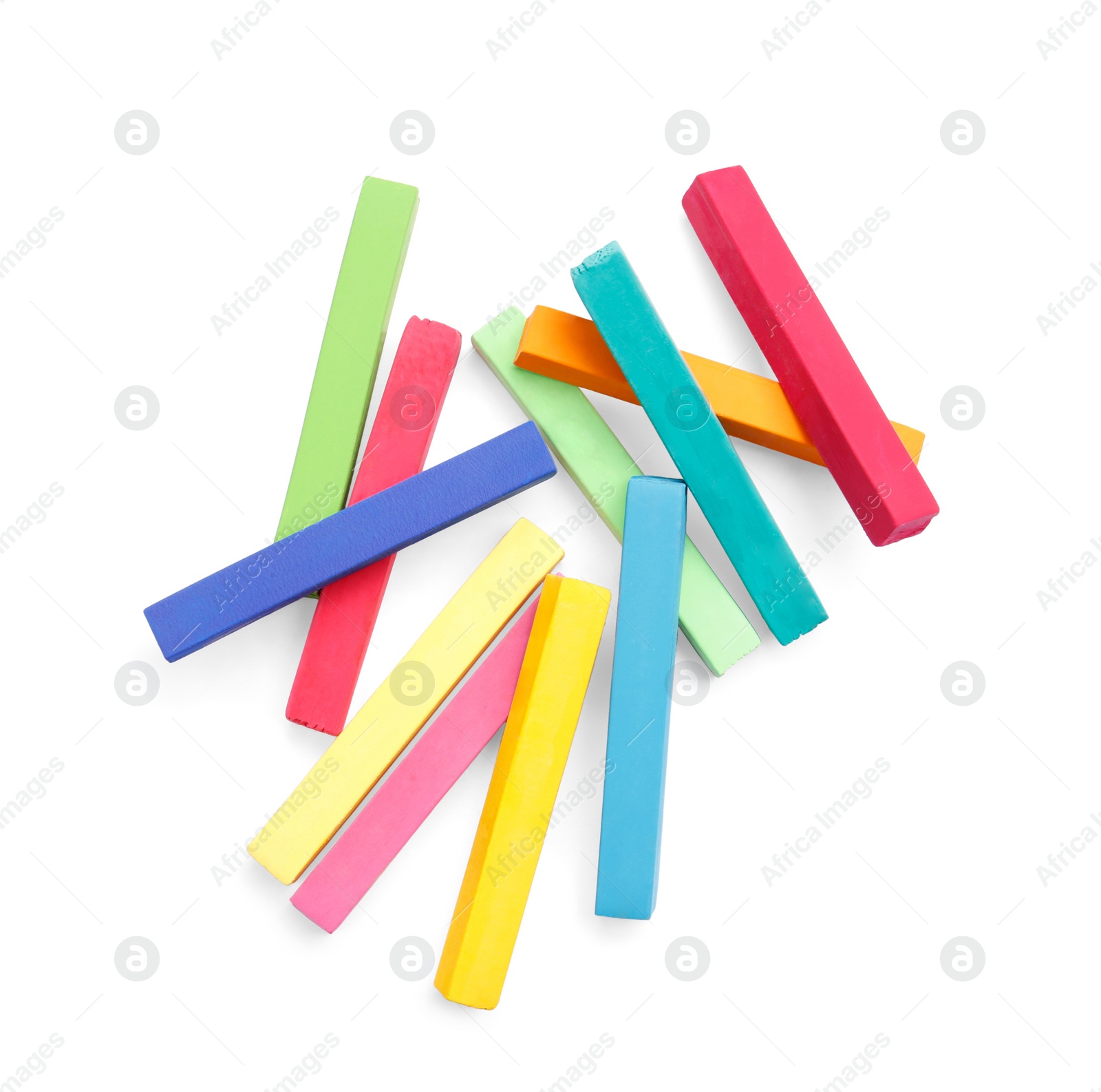 Photo of Colorful pastels on white background, top view. Drawing materials