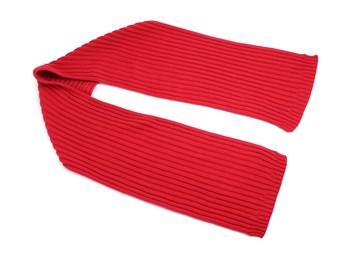 Photo of One red knitted scarf on white background, top view