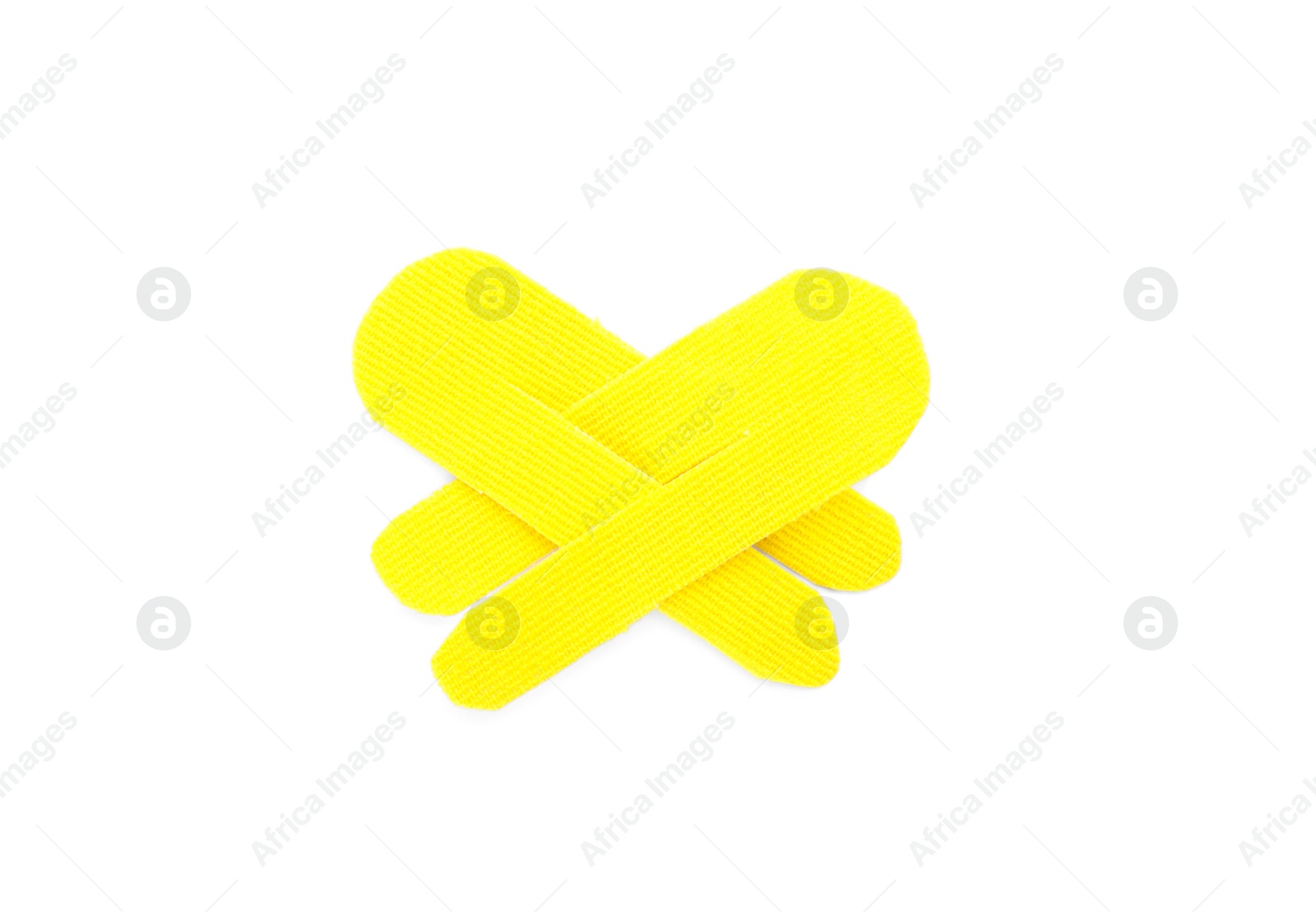 Photo of Yellow kinesio tape pieces on white background, top view