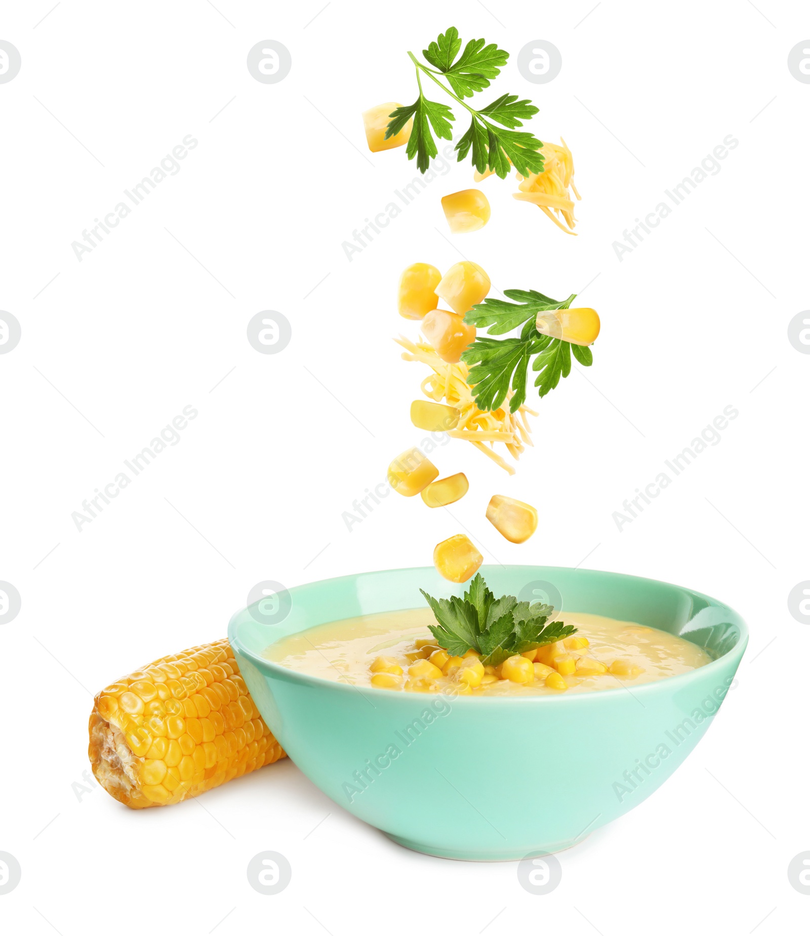 Image of Collage with ingredients falling into bowl of corn soup on white background 