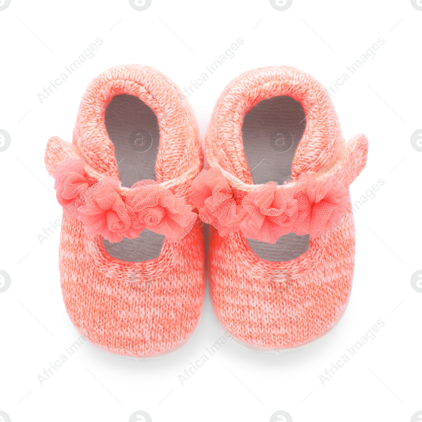 Photo of Pair of pink baby shoes on white background, top view