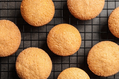 Photo of Baking grid with Danish butter cookies on grey background, top view