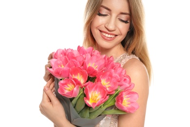 Photo of Portrait of smiling young girl with beautiful tulips on white background. International Women's Day