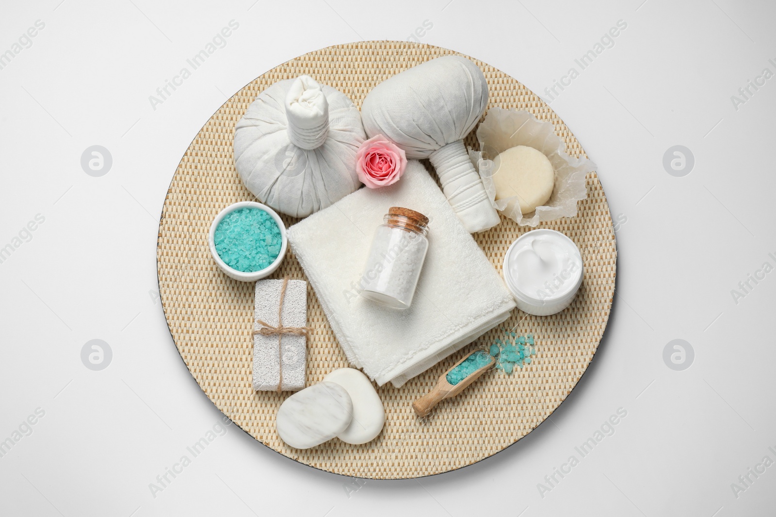 Photo of Beautiful spa composition with herbal massage bags and different care products on white background, top view