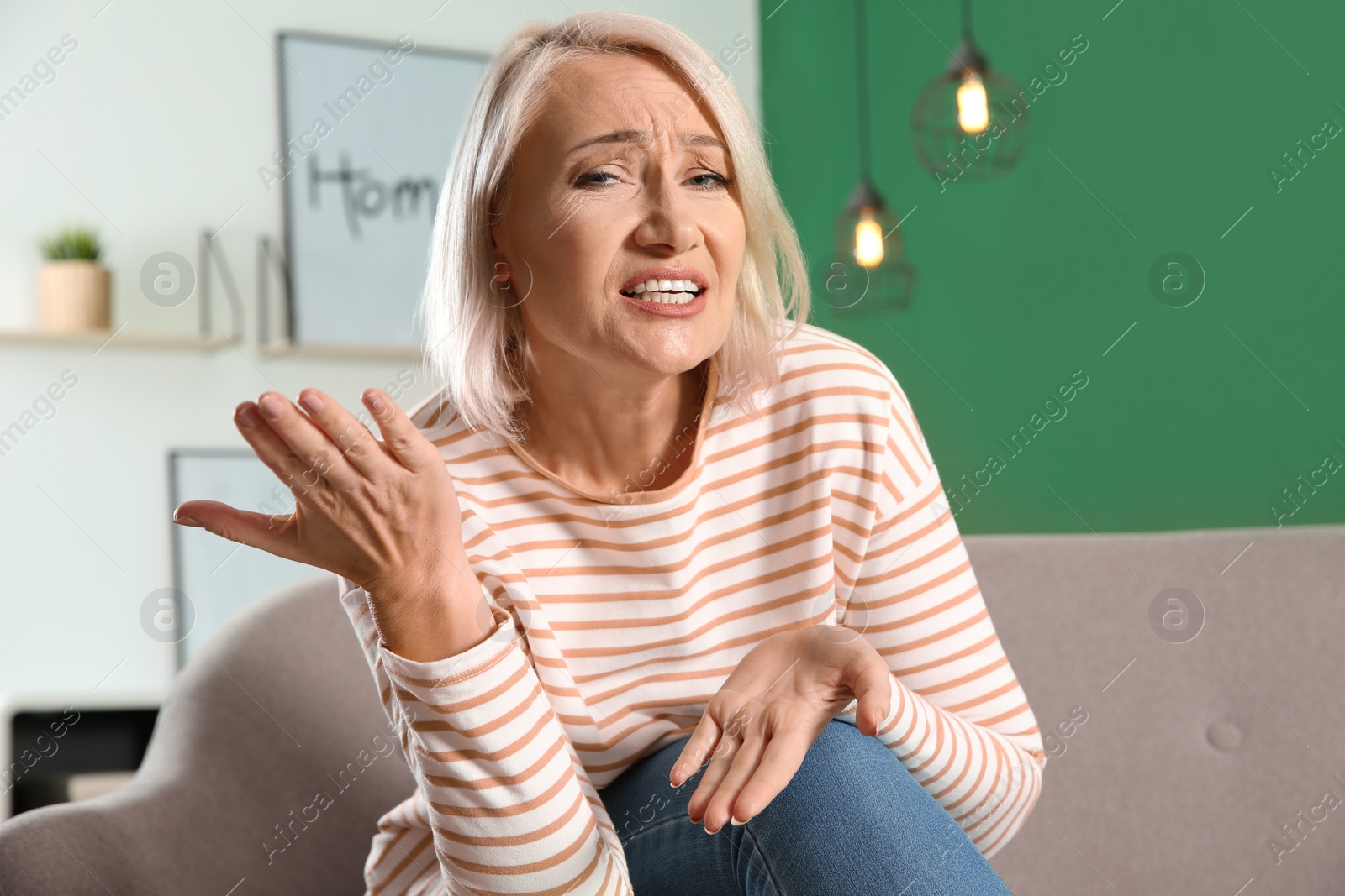 Photo of Mature woman using video chat at home, view from web camera