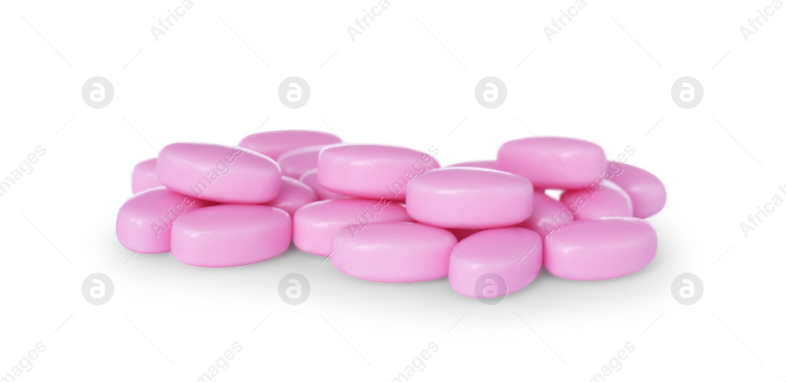 Photo of Tasty pink dragee candies on white background