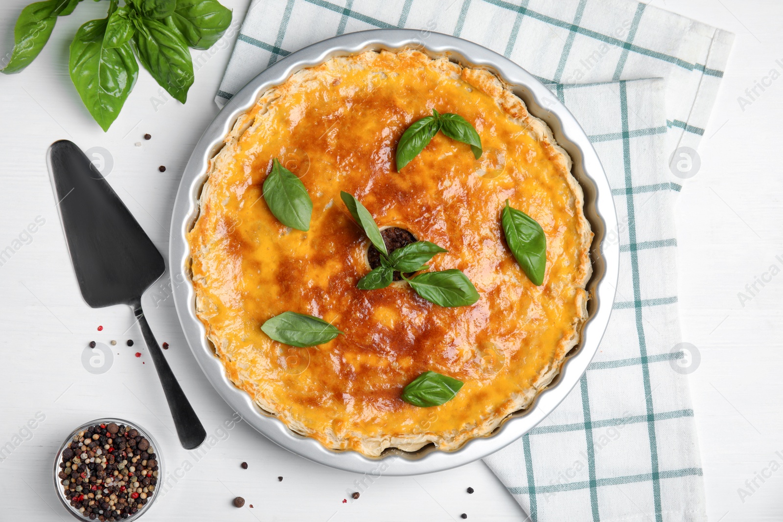 Photo of Delicious pie with minced meat on white table, flat lay