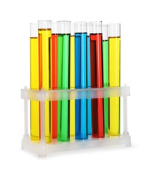 Photo of Many test tubes with colorful liquids in stand isolated on white