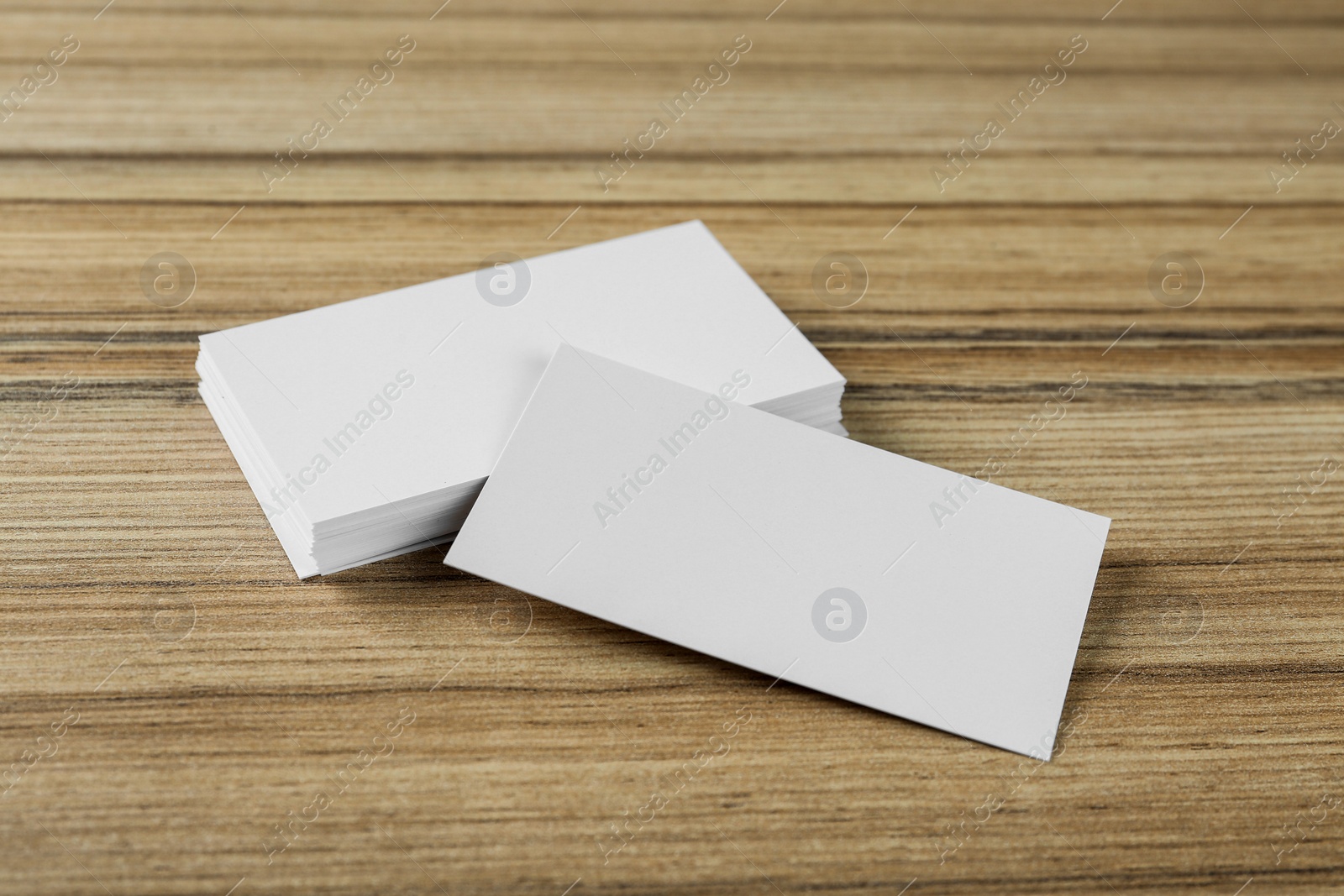 Photo of Blank business cards on wooden background. Mockup for design