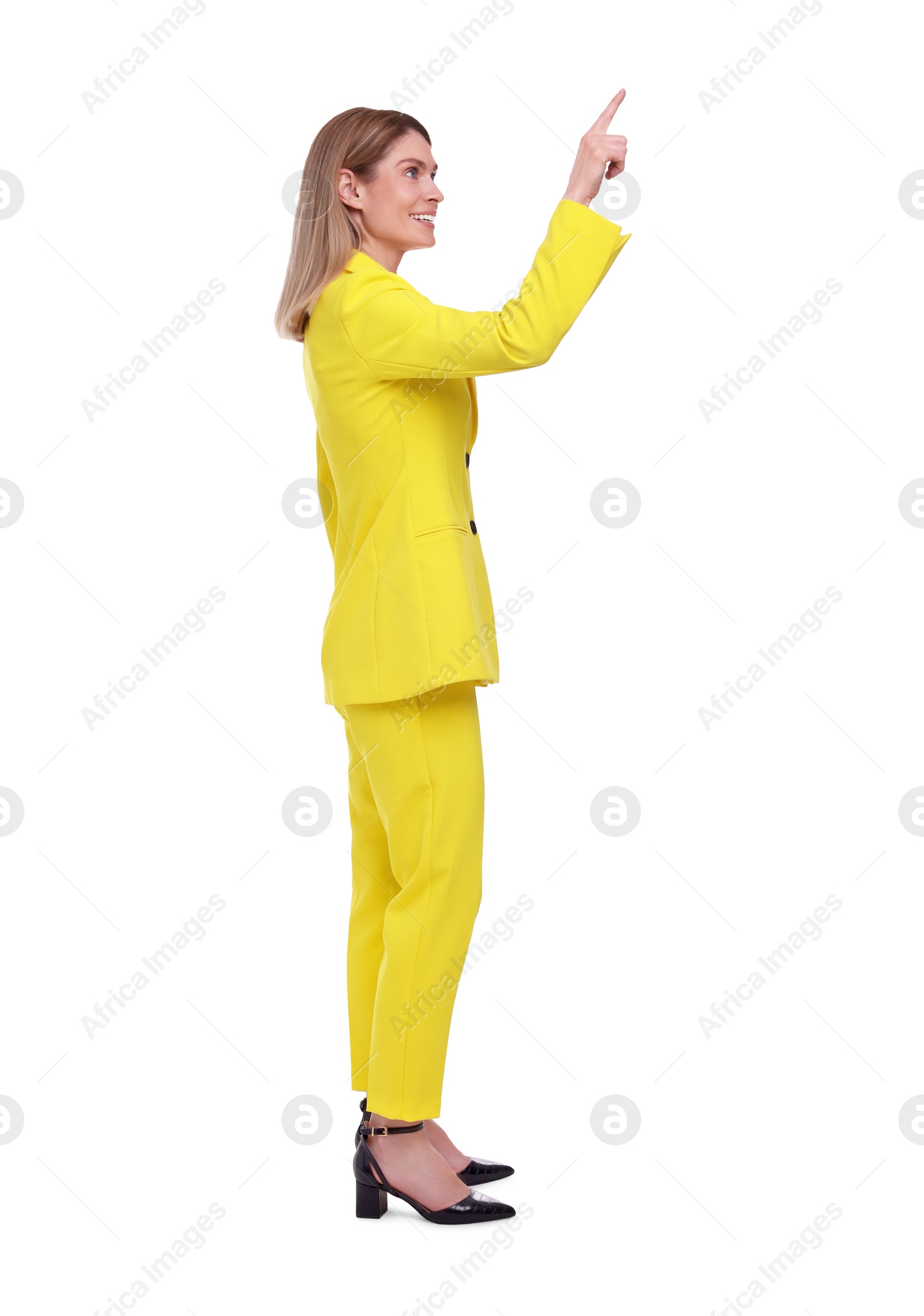 Photo of Beautiful happy businesswoman pointing at something on white background