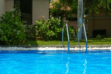 Photo of Modern swimming pool with stairs, outdoors