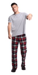 Photo of Somnambulist in pajamas on white background. Sleepwalking