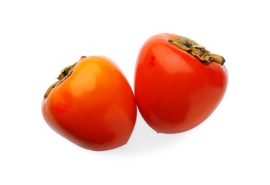 Photo of Delicious ripe juicy persimmons on white background, top view