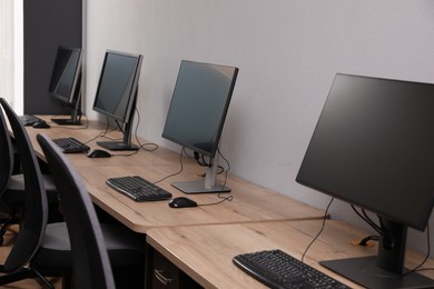 Photo of Many modern computers in open space office