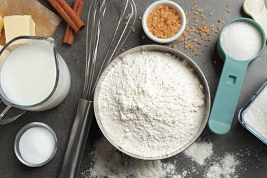 Photo of Flat lay composition with fresh ingredients for delicious homemade cake on grey table