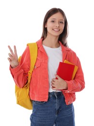 Photo of Teenage girl with books and backpack on white background