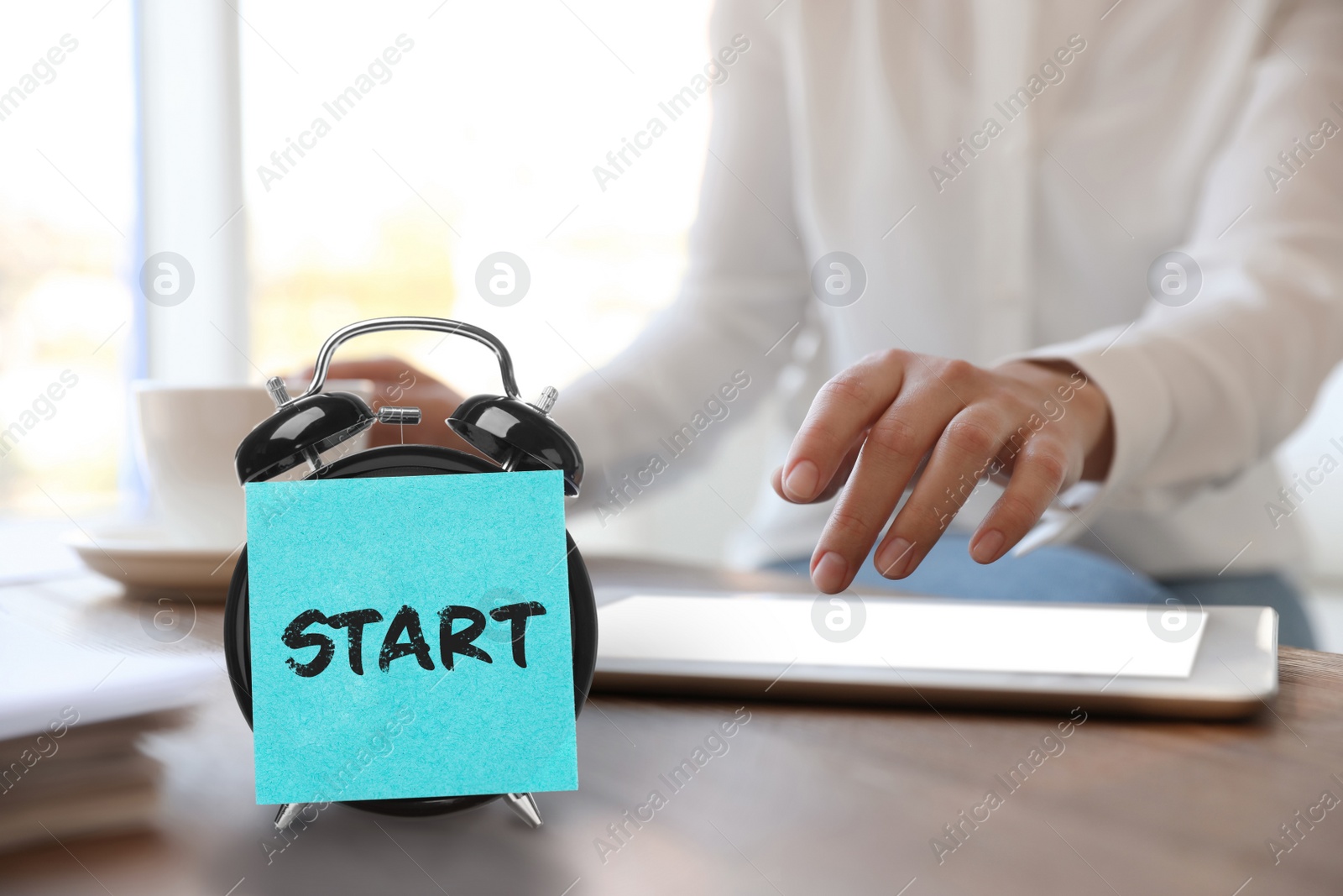 Image of New job. Woman working at table, focus on sticker with word Start