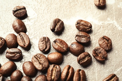 Photo of Roasted coffee beans on grey background, closeup